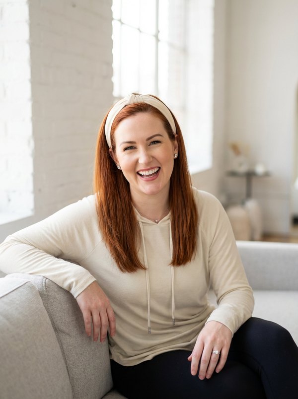 Carrie smiling, leaning forward